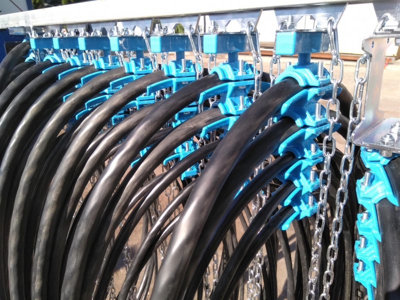 Preparation of cable trolleys for the production festoon system for the